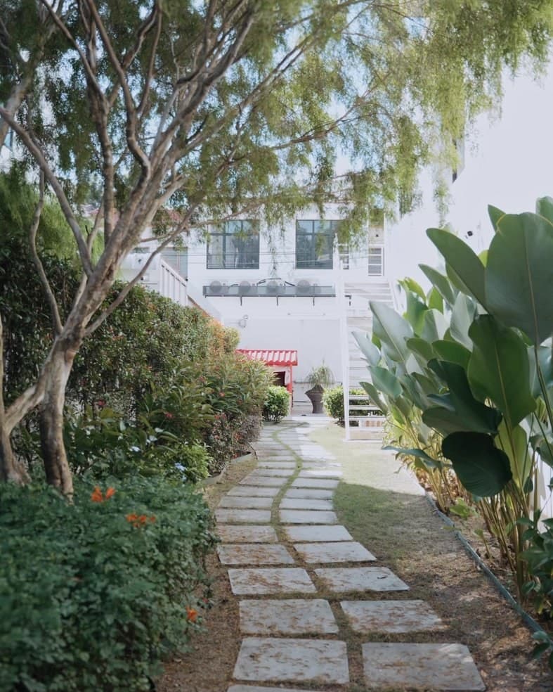 The garden pathway leading to The Garden Dental's entrance in Penang